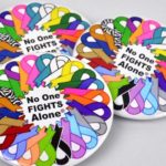 No One Fights Alone® Multicolored Ribbon Button Image