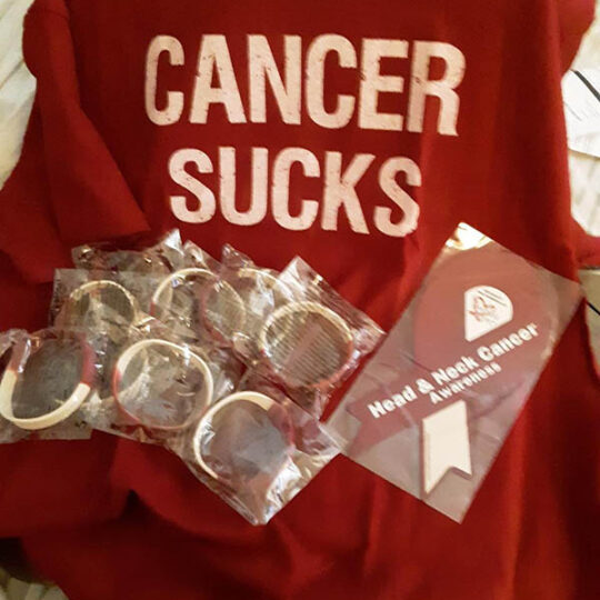 cancer sucks blanket with car magnet and wrist bands in burgundy and white