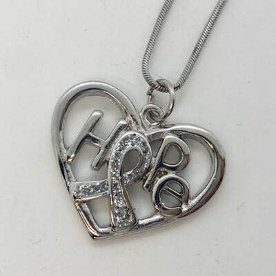 metal hope heart necklace, with a ribbon in the middle