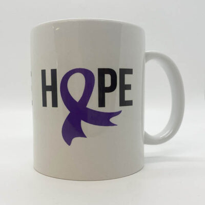 white coffee mug with bold black text with a dark blue ribbon as an O