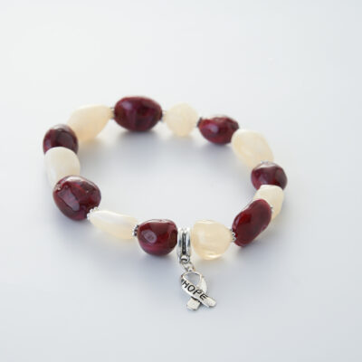 red and white stone beaded bracelet with hope ribbon charm