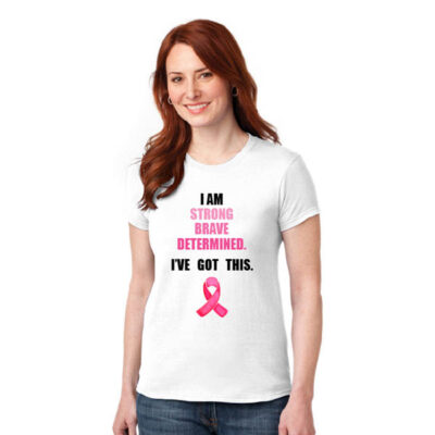 white woman's shirt with black bold text reading I am strong brave determined I've got this, with the three adjectives being pink