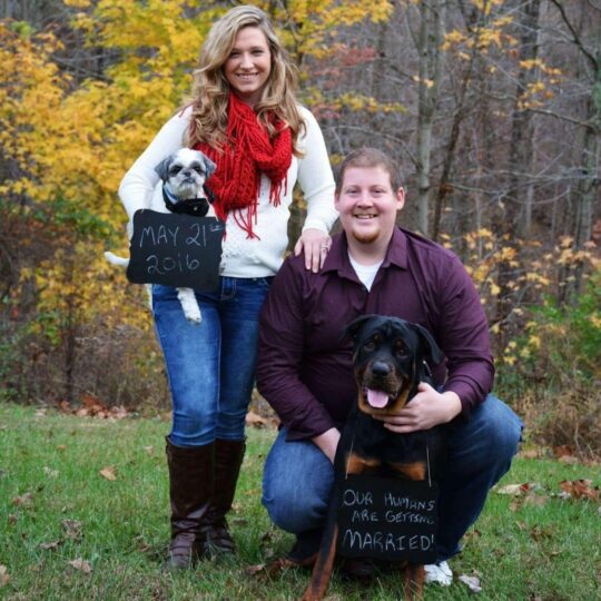 A picture of Ryan and family, with two dogs announcing their marriage