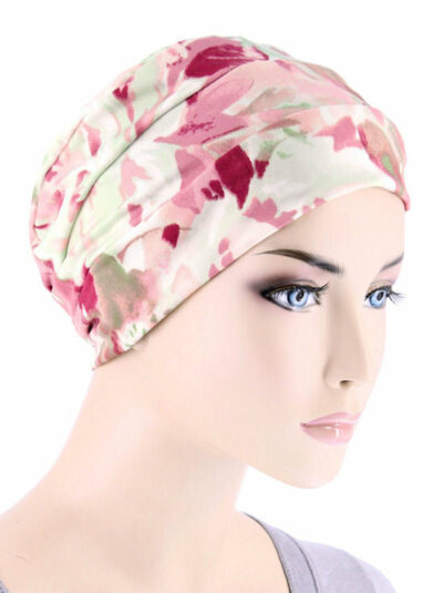 white head covering with pink leaf design