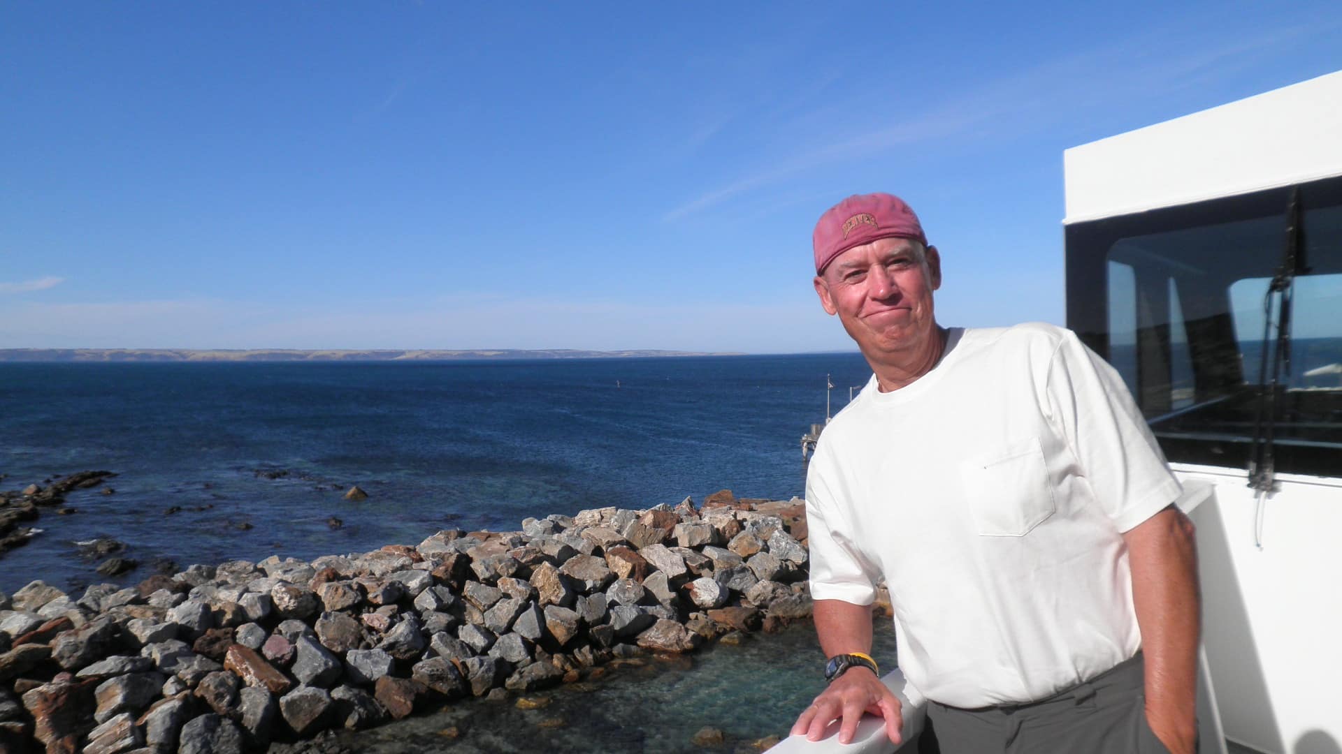 picture of a man overlooking the water