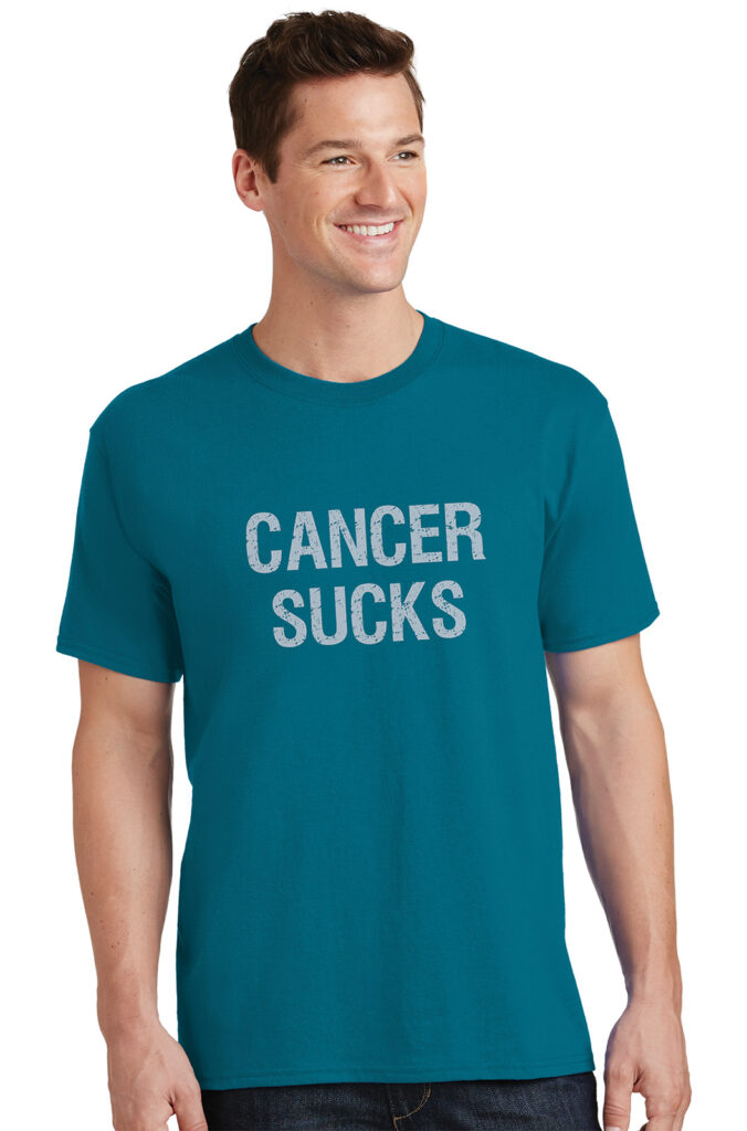Cancer Sucks® T-Shirt in Teal with distressed design printed on the front of the t-shirt