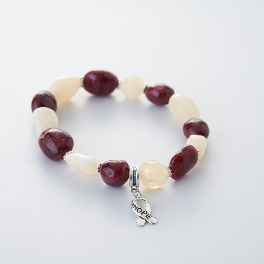 Ribbon of Hope Bracelet in burgundy and white color representing head and neck cancer awareness
