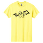 No One Fights Alone® Cancer Research T-Shirt shirt color Cornsilk with white No One Fights Alone Cancer Awareness ribbon design printed on the t-shirt in black.