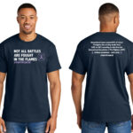 Image showing our Firefighter Cancer Awareness T-shirt that has the phrase "Not all battles are fought in the flames" with a Lavender cancer awareness ribbon printed on the front of the Navy Blue t-shirt. On the back of the shirt, is a statistic about the majority of line-of-duty deaths for firefighters being related to cancer caused by their job.