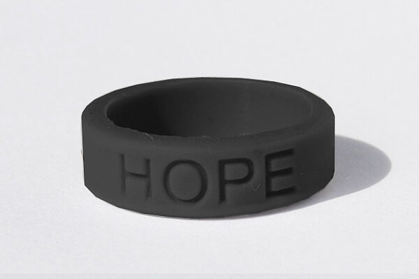 Silicone HOPE ring in Black color with the word "HOPE" debossed on the ring.