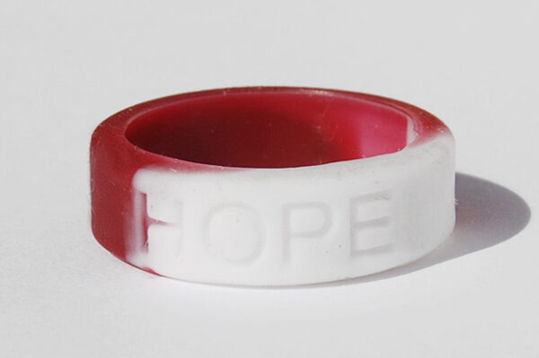 Silicone HOPE ring in Burgundy/White color with the word "HOPE" debossed on the ring.