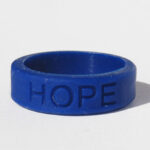 Silicone HOPE ring in Dark Blue color with the word "HOPE" debossed on the ring.