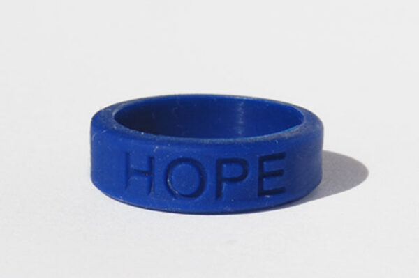 Silicone HOPE ring in Dark Blue color with the word "HOPE" debossed on the ring.