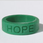 Silicone HOPE ring in Emerald color with the word "HOPE" debossed on the ring.