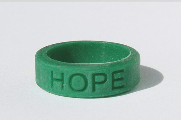 Silicone HOPE ring in Emerald color with the word "HOPE" debossed on the ring.