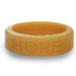 Silicone HOPE ring in Gold color with the word "HOPE" debossed on the ring.