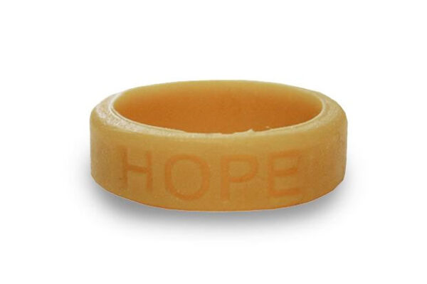 Silicone HOPE ring in Gold color with the word "HOPE" debossed on the ring.