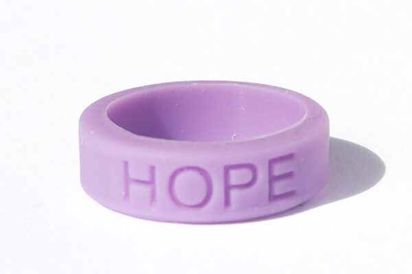 Silicone HOPE ring in Lavender color with the word "HOPE" debossed on the ring.