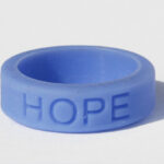 Silicone HOPE ring in Periwinkle color with the word "HOPE" debossed on the ring.