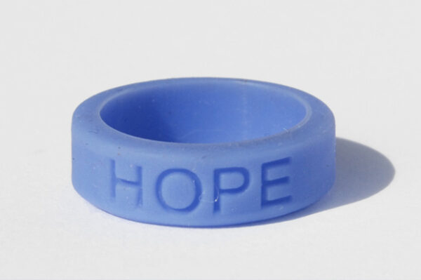Silicone HOPE ring in Periwinkle color with the word "HOPE" debossed on the ring.
