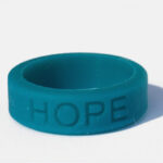 Silicone HOPE ring in Teal color with the word "HOPE" debossed on the ring.