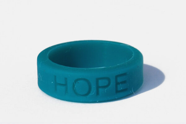 Silicone HOPE ring in Teal color with the word "HOPE" debossed on the ring.