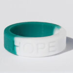 Silicone HOPE ring in Teal and White color with the word "HOPE" debossed on the ring.