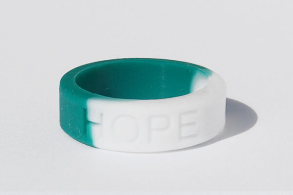 Silicone HOPE ring in Teal and White color with the word "HOPE" debossed on the ring.