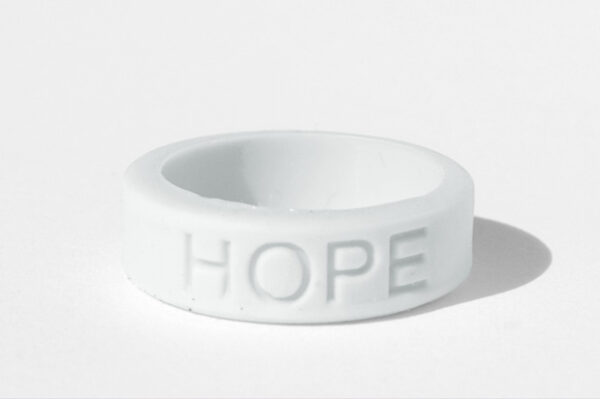 Silicone HOPE ring in White color with the word "HOPE" debossed on the ring.