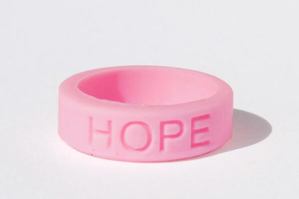 Silicone HOPE ring in Pink color with the word "HOPE" debossed on the ring.