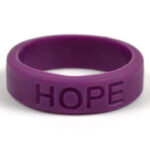 Silicone HOPE ring in Plum color with the word "HOPE" debossed on the ring.