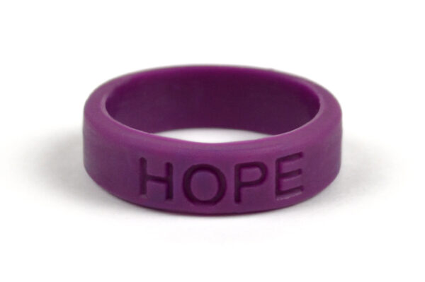 Silicone HOPE ring in Plum color with the word "HOPE" debossed on the ring.