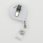back side of the No One Fights Alone® Retractable Badge Holder that has an alligator clip for clipping the badge reel to garments