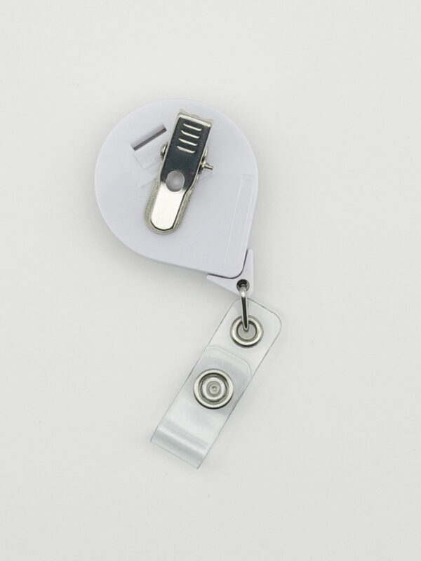 back side of the No One Fights Alone® Retractable Badge Holder that has an alligator clip for clipping the badge reel to garments