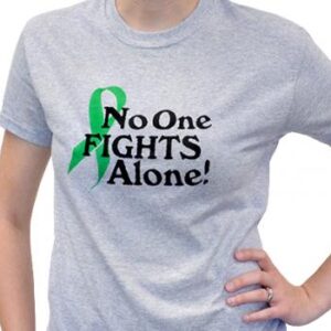 Group image showing our No One Fights Alone® T-shirt that has the wording "No One Fights Alone!" and a cancer awareness ribbon printed on the front of the t-shirt which is a light heather grey color.