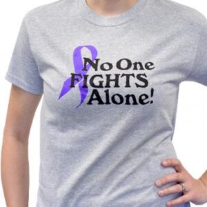 Group image showing our No One Fights Alone® T-shirt that has the wording "No One Fights Alone!" and a cancer awareness ribbon printed on the front of the t-shirt which is a light heather grey color.