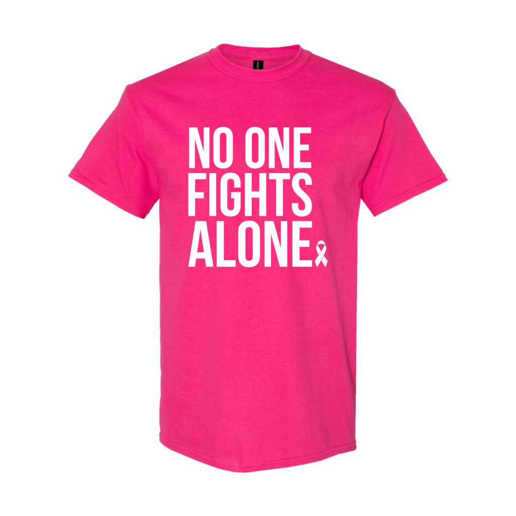 Image showing our Breast Cancer Awareness T-shirt: No One Fights Alone® which is a hot pink t-shirt with the "No One Fights Alone" wording and a cancer awareness ribbon printed on the front of the t-shirt in white ink.