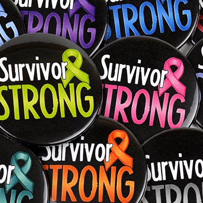 Image showing our cancer survivor buttons that are 2.25 inch diameter and have the words 'Survivor Strong' with a cancer awareness ribbon printed on each button.