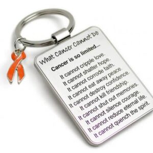 Group Image showing our What Cancer Cannot Do® Keychain with Ribbon Charm which a metal dog tag keychain that has the "What Cancer Cannot Do®" Poem laser engraved onto the keychain, with a cancer awareness ribbon charm in the color of your choice hooked onto the key ring of the keychain.