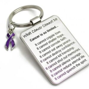 Group Image showing our What Cancer Cannot Do® Keychain with Ribbon Charm which a metal dog tag keychain that has the "What Cancer Cannot Do®" Poem laser engraved onto the keychain, with a cancer awareness ribbon charm in the color of your choice hooked onto the key ring of the keychain.