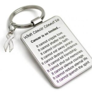 Group Image showing our What Cancer Cannot Do® Keychain with Ribbon Charm which a metal dog tag keychain that has the "What Cancer Cannot Do®" Poem laser engraved onto the keychain, with a cancer awareness ribbon charm in the color of your choice hooked onto the key ring of the keychain.