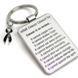 Group Image showing our What Cancer Cannot Do® Keychain with Ribbon Charm which a metal dog tag keychain that has the "What Cancer Cannot Do®" Poem laser engraved onto the keychain, with a cancer awareness ribbon charm in the color of your choice hooked onto the key ring of the keychain.
