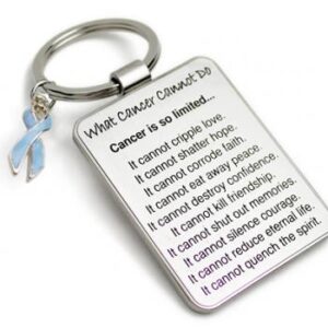 Group Image showing our What Cancer Cannot Do® Keychain with Ribbon Charm which a metal dog tag keychain that has the "What Cancer Cannot Do®" Poem laser engraved onto the keychain, with a cancer awareness ribbon charm in the color of your choice hooked onto the key ring of the keychain.