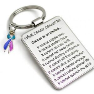 Group Image showing our What Cancer Cannot Do® Keychain with Ribbon Charm which a metal dog tag keychain that has the "What Cancer Cannot Do®" Poem laser engraved onto the keychain, with a cancer awareness ribbon charm in the color of your choice hooked onto the key ring of the keychain.