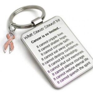 Group Image showing our What Cancer Cannot Do® Keychain with Ribbon Charm which a metal dog tag keychain that has the "What Cancer Cannot Do®" Poem laser engraved onto the keychain, with a cancer awareness ribbon charm in the color of your choice hooked onto the key ring of the keychain.