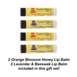 Image shows the four naked bee lip balms that are included in the cozy blanket gift set - there are two orange blossom honey and two lavender beeswax lip balms included in this set.