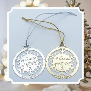 image showing the two variations of our 'Season of Hope 2025 holiday ornament' one in gold and one in silver. Each ornament is laser cut with the wording, "A Season of Hope" in the center and a snowflake pattern connecting to an outer circle that has the year, 2025, with the words, "CHOOSE HOPE" at the bottom of the ornament.