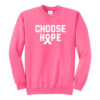 Image shows our Choose Hope Cancer Awareness Crewneck Sweatshirt in the color Neon Pink with the words 'CHOOSE HOPE' and a cancer awareness ribbon printed on the front of the sweatshirt in white ink.