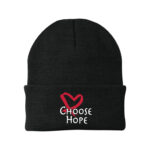 Image showing our Choose Hope Knit Beanie in Black, with the white and Red Choose Hope logo embroidered on the front of the beanie