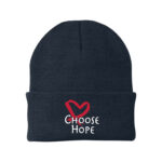 Image showing our Choose Hope Knit Beanie in Navy, with the white and Red Choose Hope logo embroidered on the front of the beanie